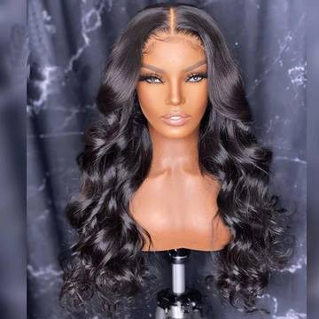 a wig with long wavy hair on a mannequin head