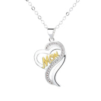 a silver and gold necklace with the word mom on it