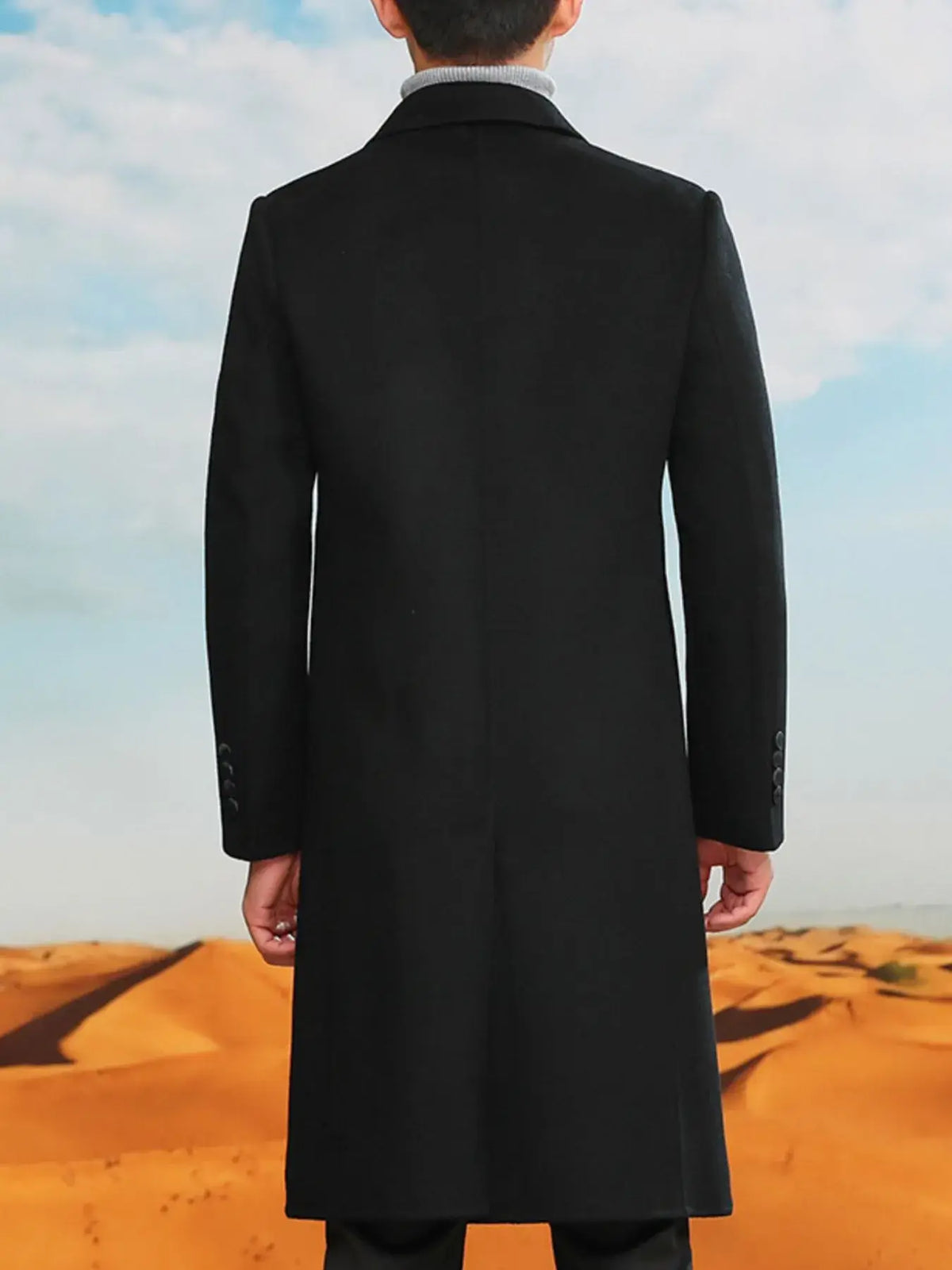 Men's plus size double-breasted long wool coat, displayed from the back in a desert setting.