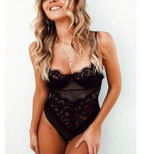 a woman in a black lingerie posing for a picture