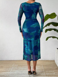 Back view of a Watercolor Print Mesh Bodycon Midi Dress showcasing vibrant colors and a fitted silhouette.