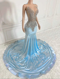 a mannequin is dressed in a blue gown