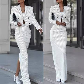 a woman in a white suit and heels