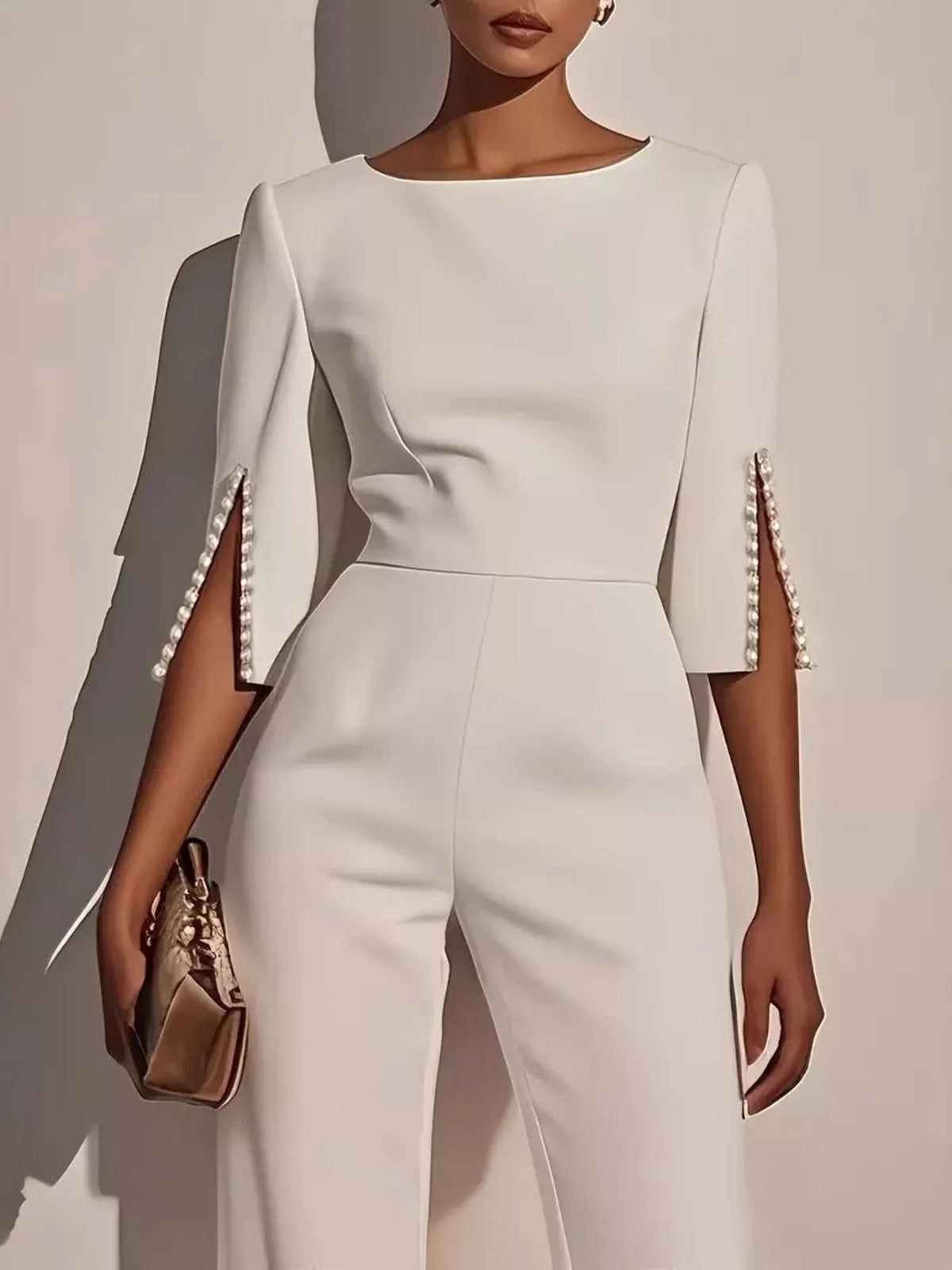 Wide-Leg Jumpsuit with Slit Sleeve featuring pearl details on the sleeves and a sleek, modern design.