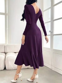 Model wearing Ruffle Hem Long Sleeve Midi Dress in purple, showcasing back view and ruffled hem in stylish setting.