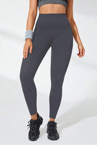High waist active leggings in dark gray, made of stretchy material for comfort and style, perfect for workouts.