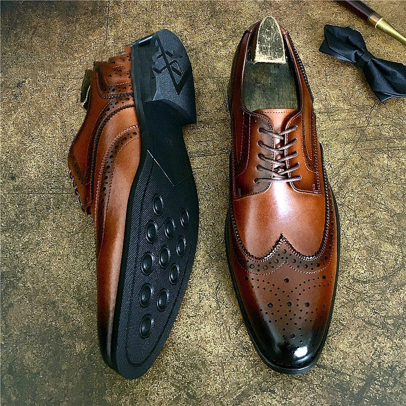 Genuine leather brogue business shoes in rich brown with brogue detailing and rubber sole, ideal for formal occasions.