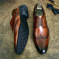 Genuine leather brogue business shoes in rich brown with brogue detailing and rubber sole, ideal for formal occasions.
