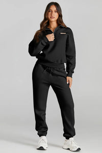 Model wearing a black quarter zip top and drawstring pants active set, showcasing affordable activewear.