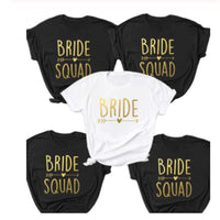 six bride squad shirts with gold lettering on them