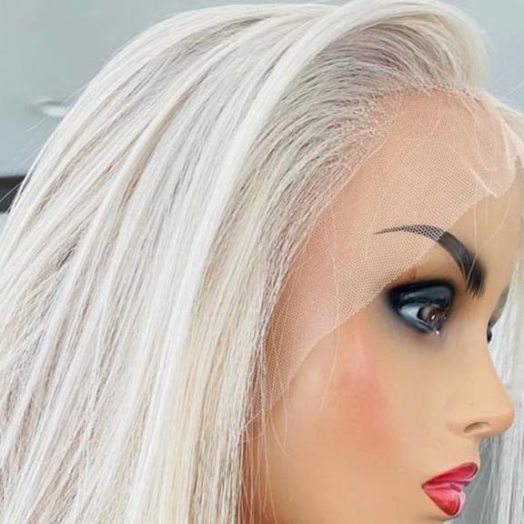 a mannequin head with white hair and blue eyes