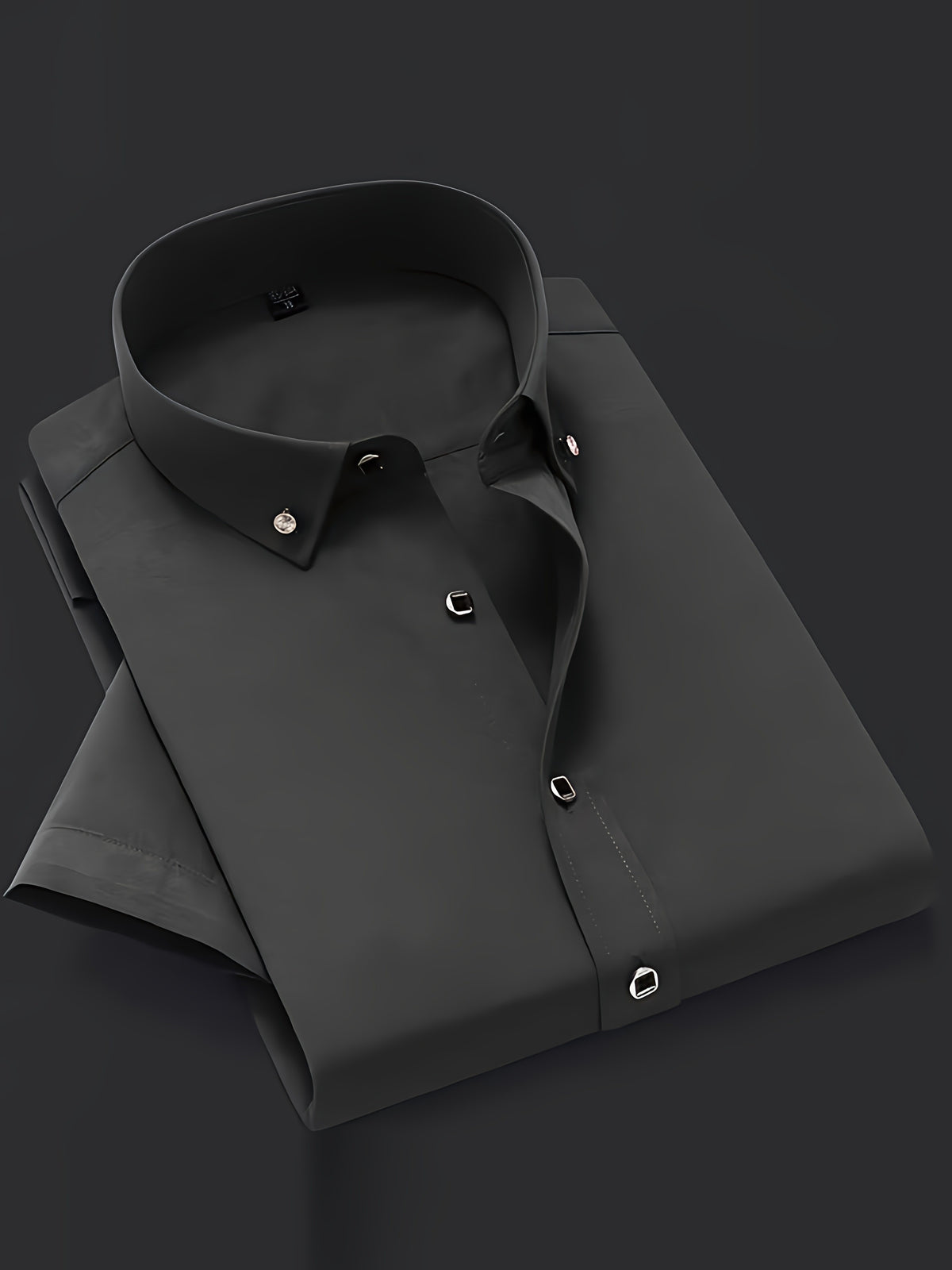 a black dress shirt on a black background