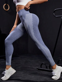 Model showcasing striped high waist active pants in a stylish pose, highlighting affordability and comfort in activewear.