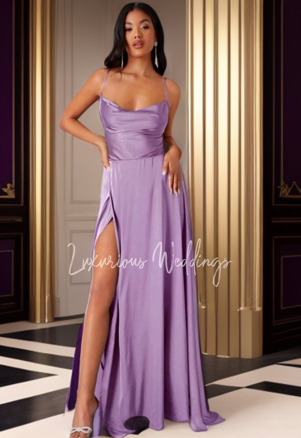 a woman in a purple dress posing for a picture