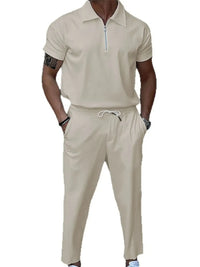 Men's plus size quarter zip short sleeve polo and pants set in beige with drawstring and pocket.
