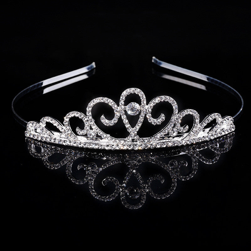 a tiara on a black background with a reflection