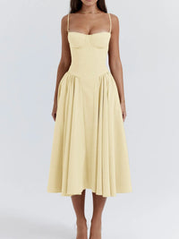 Ruched sweetheart neck cami dress in yellow, featuring a flared skirt and slightly stretchy fabric.