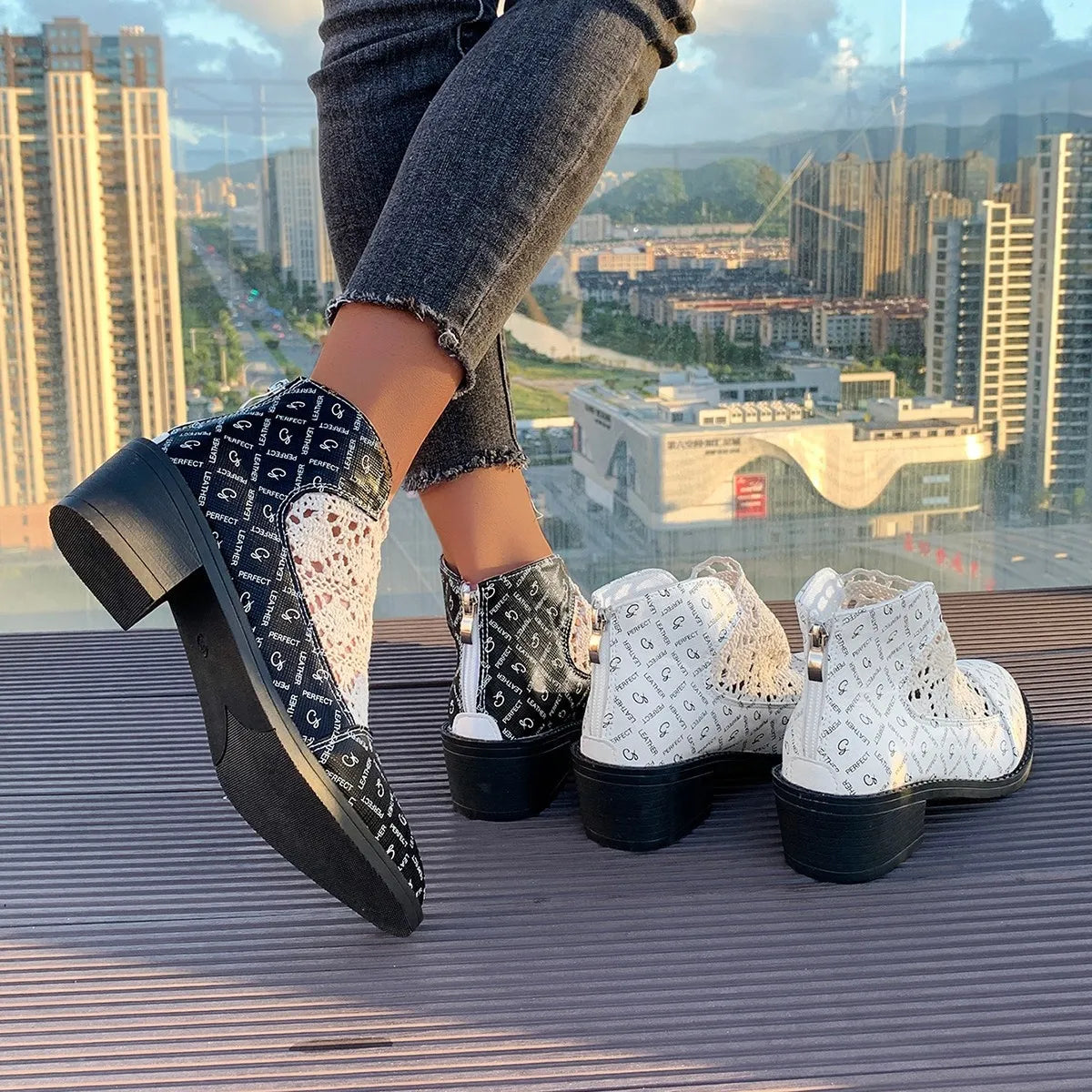 Printed point toe block heels boots in black and white with mesh detailing, perfect fit and low heel design.