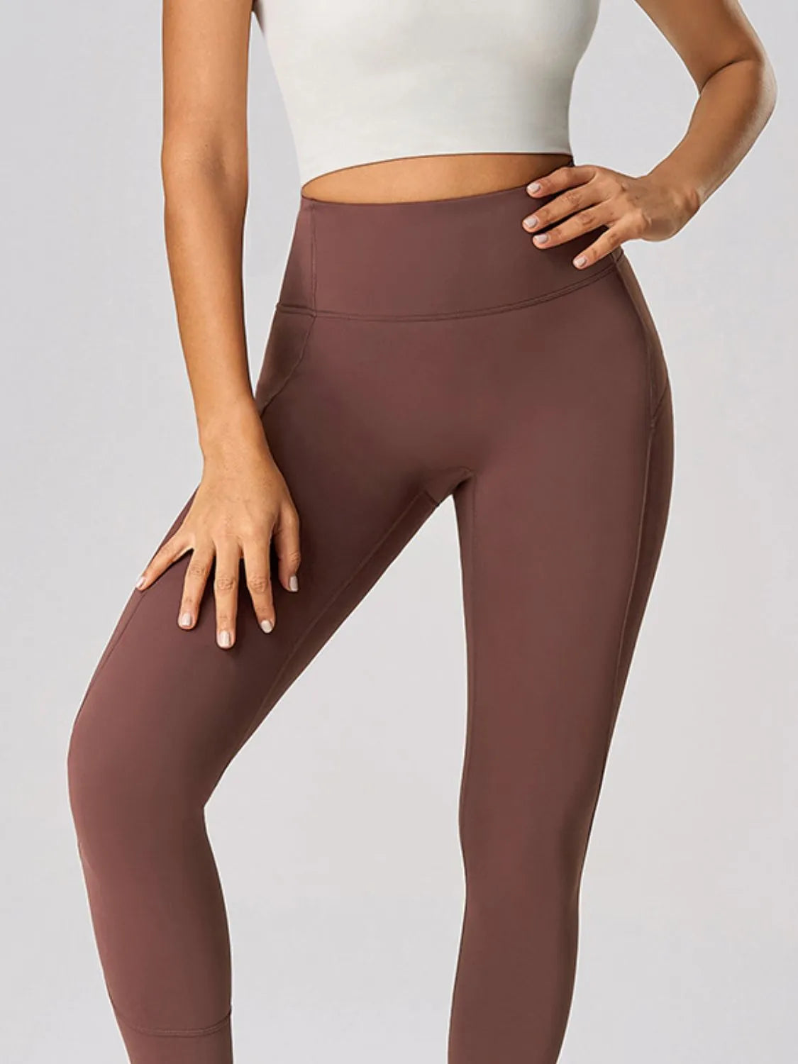 High waist active leggings in brown featuring a sleek fit, ideal for workouts and casual wear.