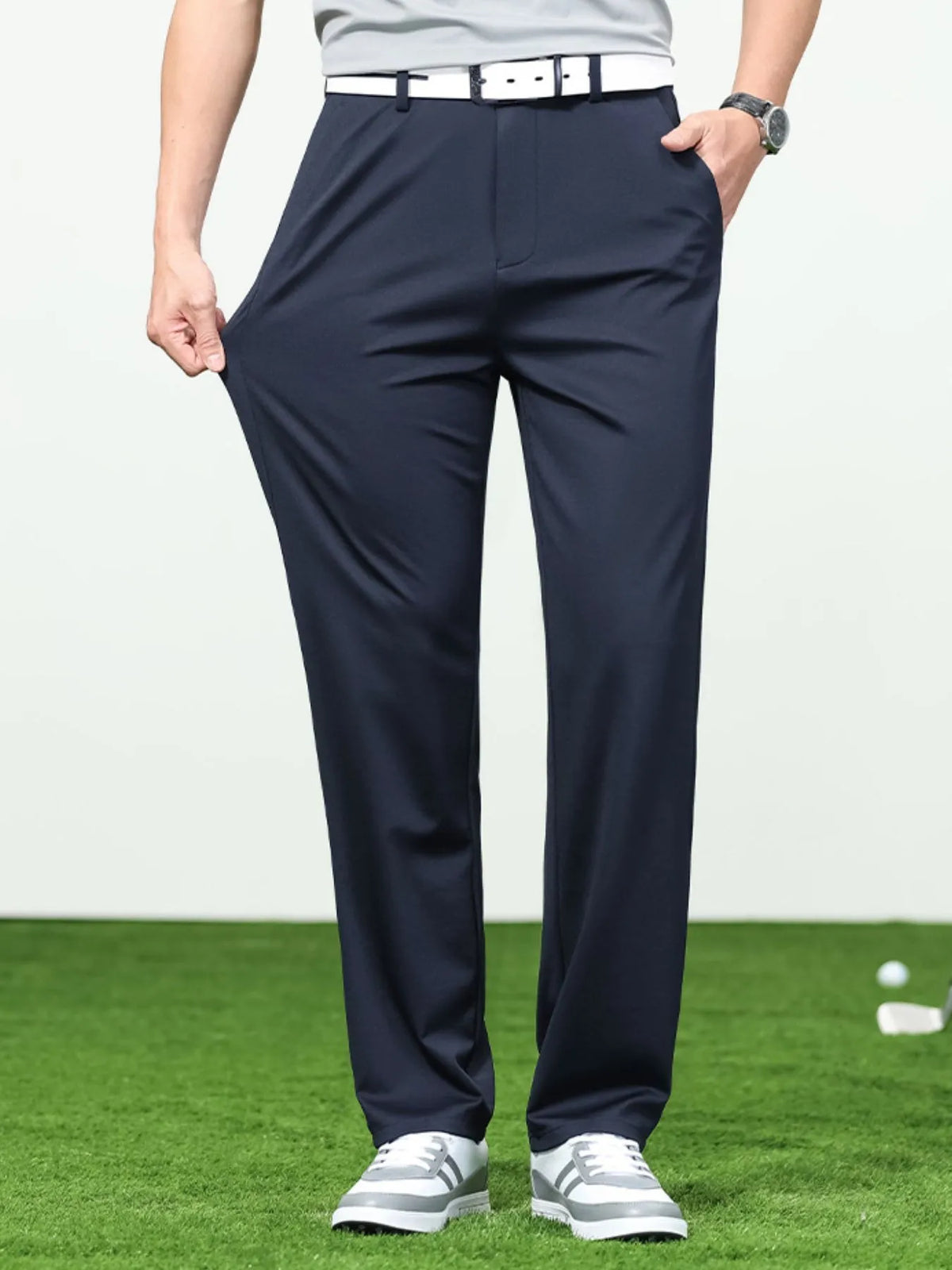 Men's loose fit pants in navy blue, featuring a comfortable design and breathable fabric, perfect for casual wear or golf.