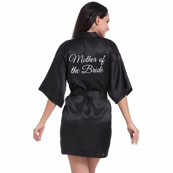 a woman in a black robe that says mother of the bride