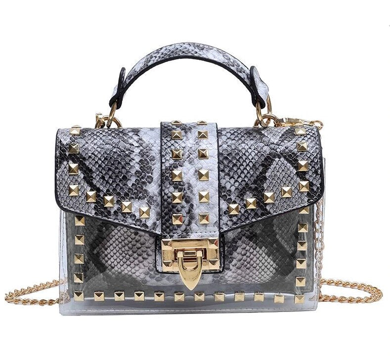 Elegant chains and rivet women's handbag, crafted from premium leather for luxurious weddings and stylish occasions.