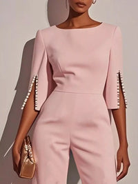 Wide-Leg Jumpsuit with Slit Sleeve in soft pink with decorative pearl details on sleeves.