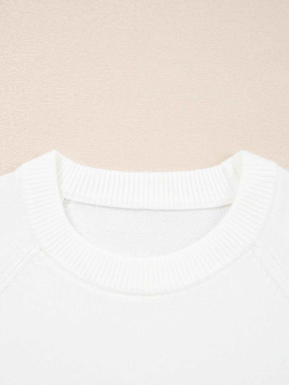 MERRY Letter Pattern Christmas Raglan Sleeve Sweater close-up of neckline in white fabric
