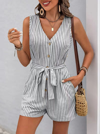 Striped V-neck button front belted romper with pockets, perfect for stylish summer looks.