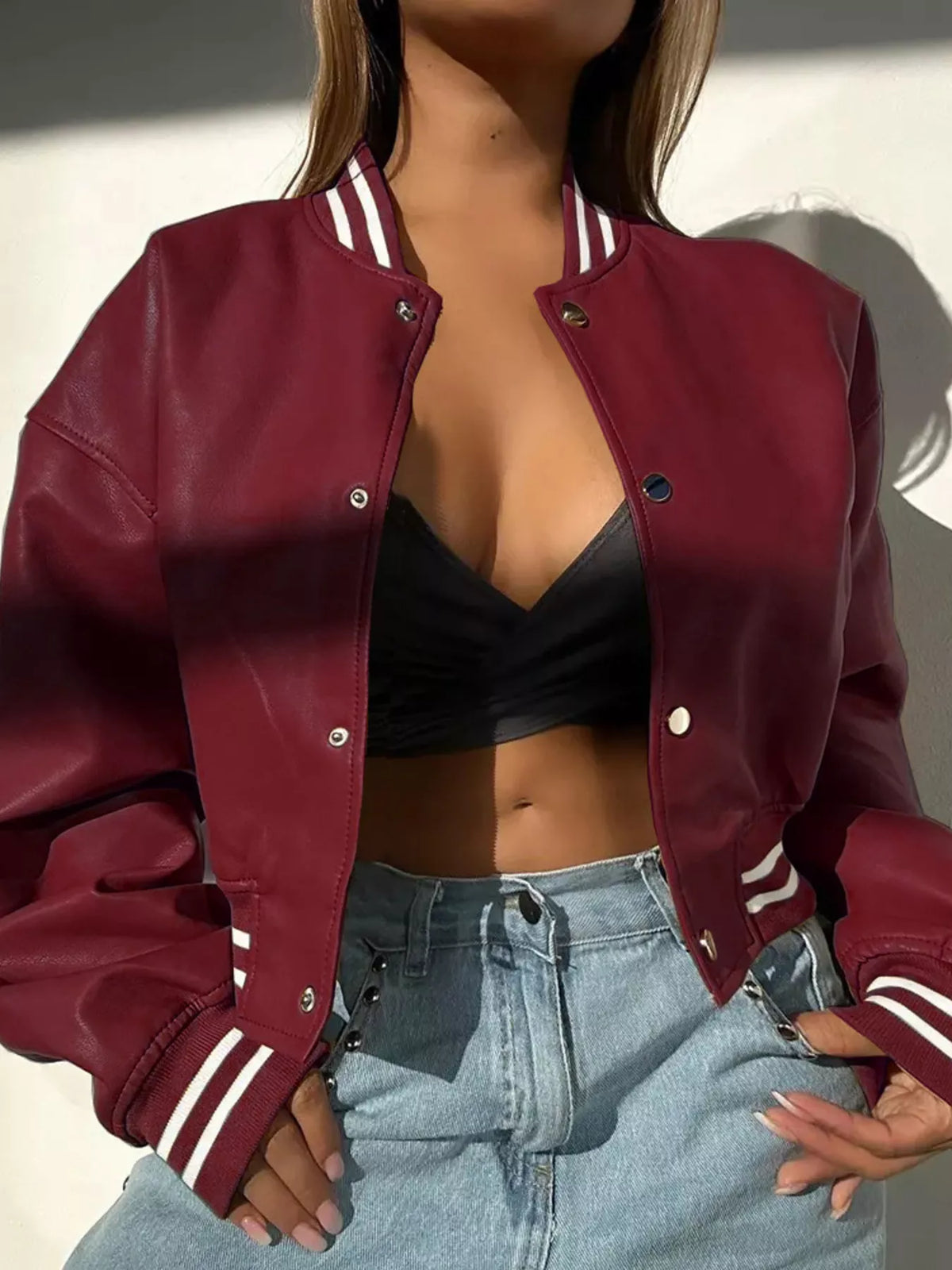 Snap Down Long Sleeve Jacket in burgundy with sporty stripes, styled with a black top and high-waisted jeans.
