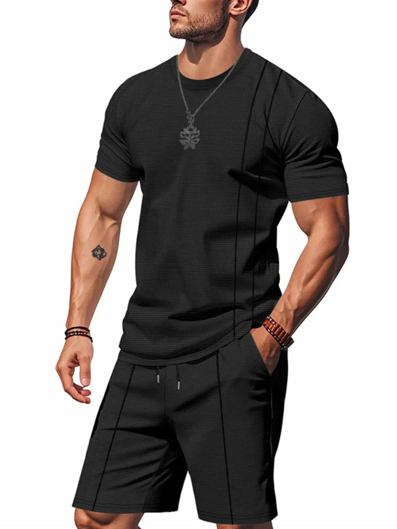 Men's plus size black round neck short sleeve top and shorts set displayed with pockets, ideal for casual wear.
