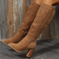 Point toe block heel boots in soft brown suede, featuring a mid-calf design and stylish zipper detail.