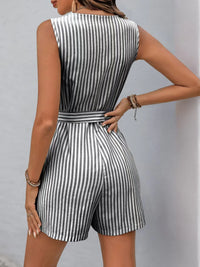 Back view of a striped V-neck belted romper showcasing its tailored fit and stylish design.