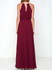 Back view of a pleated sleeveless maxi tank dress in burgundy, showcasing its elegant design and flowing silhouette.