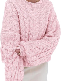 Light pink cable knit long sleeve sweater with oversized sleeves for cozy style.