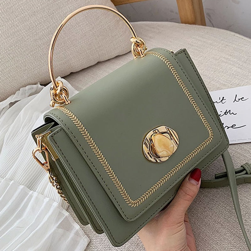 Stylish green leather mini crossbody bag with gold hardware, perfect for luxurious weddings and everyday elegance.
