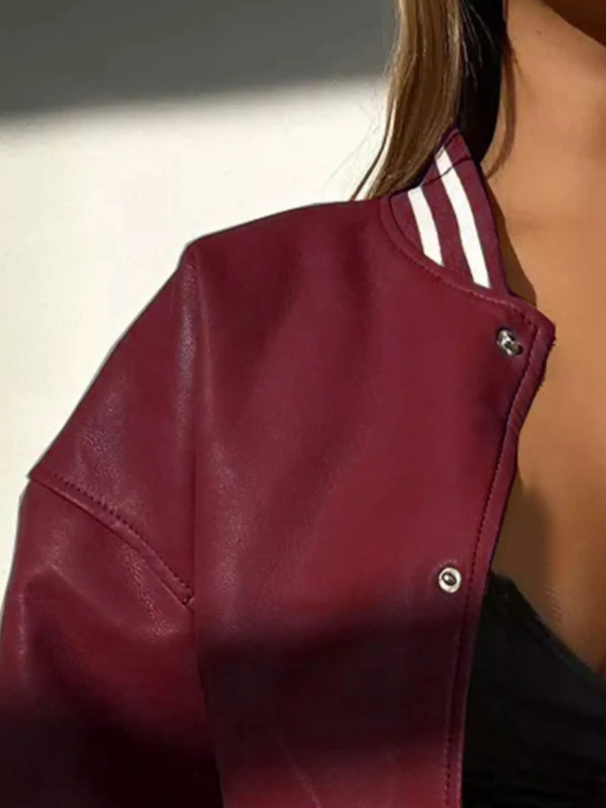 Close-up of a burgundy Snap Down Long Sleeve Jacket with striped collar, perfect for stylish casual wear.