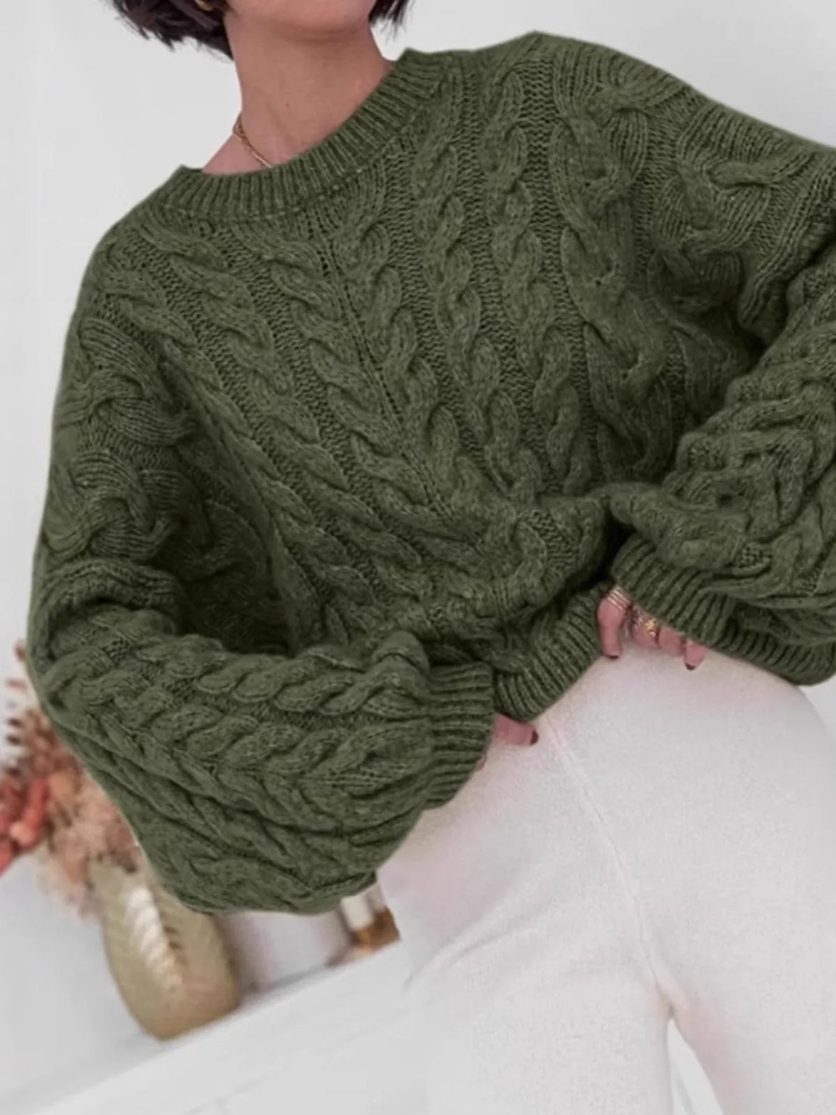 Cable knit long sleeve sweater in olive green, showcasing a cozy and stylish design, perfect for fall and winter.