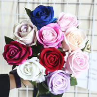 a bouquet of multicolored roses in a vase