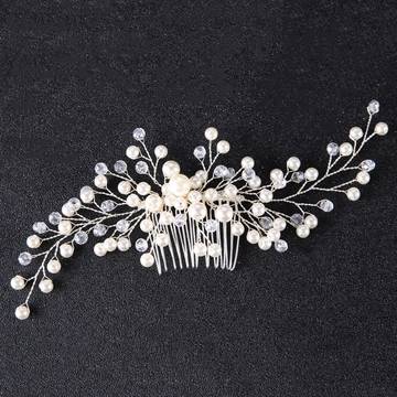 a bridal hair comb with pearls and leaves