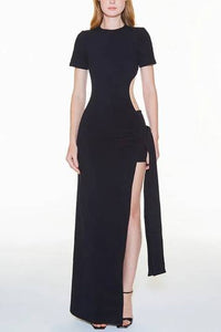 a woman in a black dress with a slit
