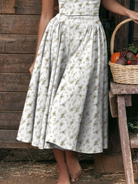 Ruched sweetheart neck cami dress with floral pattern, perfect for casual or semi-formal occasions.