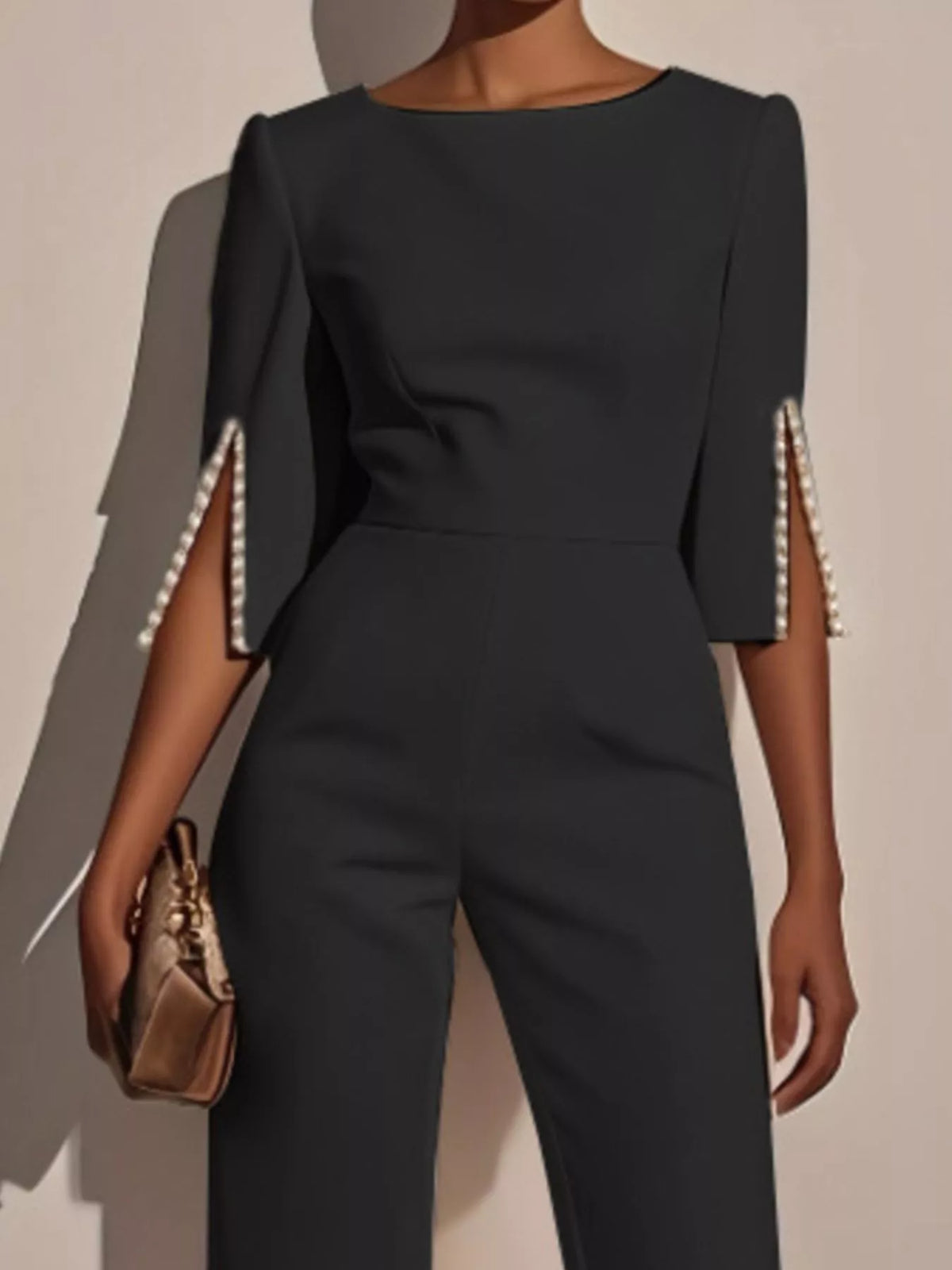 Wide-Leg Jumpsuit with Slit Sleeve featuring pearl details on sleeves and a chic design.