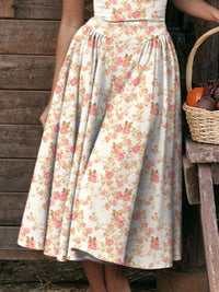 Floral print skirt with a full silhouette, featuring pink and orange flowers on a white background, styled casually.