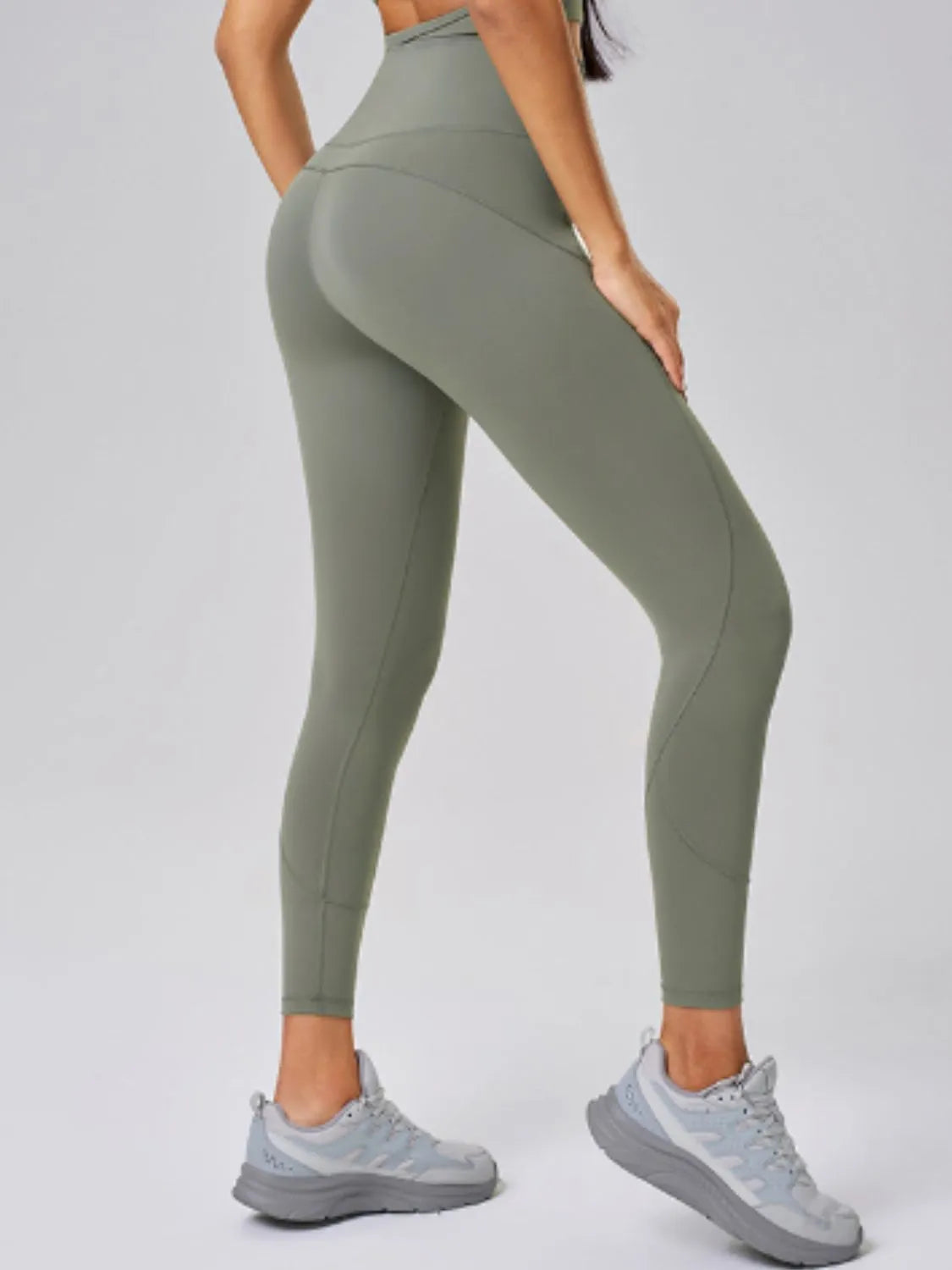 High waist active leggings in olive green, showcasing a stylish and comfortable fit, ideal for workouts.