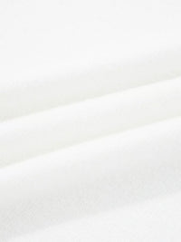 Close-up of soft white fabric showcasing texture of MERRY Letter Pattern Christmas Raglan Sleeve Sweater.