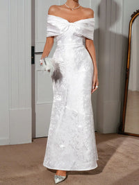 Elegant off-shoulder maxi dress in white with lace-up detailing and fitted silhouette, perfect for special occasions.