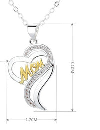 a mother's heart pendant with the word mom on it