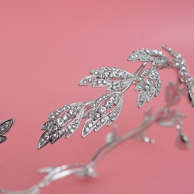 a close up of a tiara on a pink background