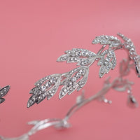 a close up of a tiara on a pink background
